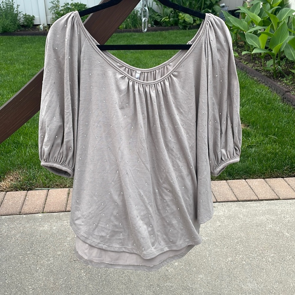 Grey light shirt with rhinestones.